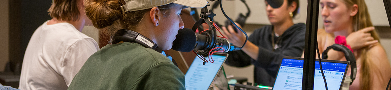 Students record a podcast for a class in the Reeder Media Center's studio
