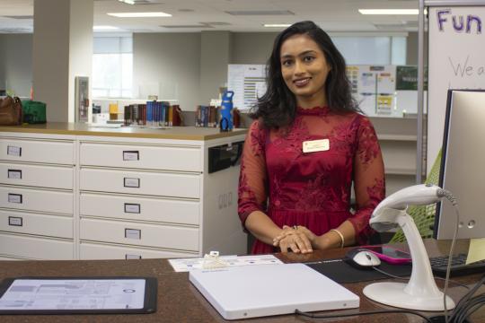 Jarin Eva at the circulation desk