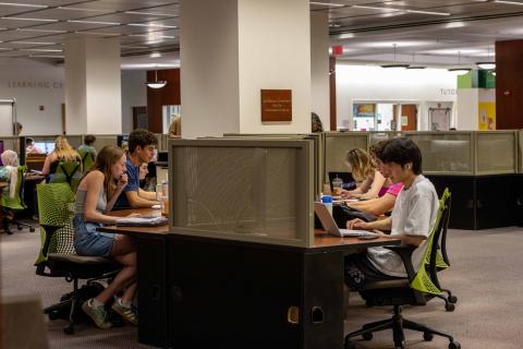 Students studying in the info commons of Swem Library