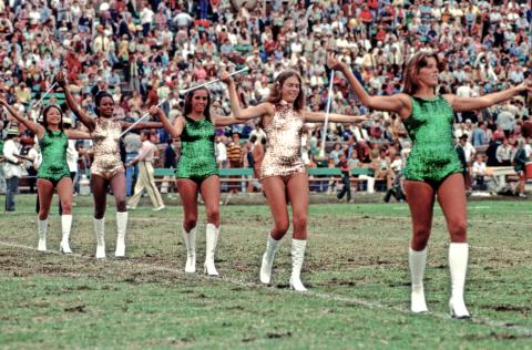  Cheer squad performing on the field of a football game