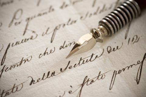 Handwritten letter with vintage fountain pen on top