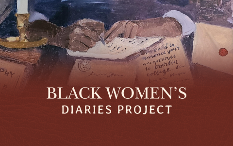 Closeup of a woman's hands writing in a diary