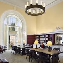 Three photos from left to right showing the interiors of different campus libraries: Law Library, Business Library, and VIMS Library.