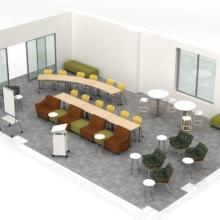 Example furniture setup with two long rows of tables and soft seating facing a podium