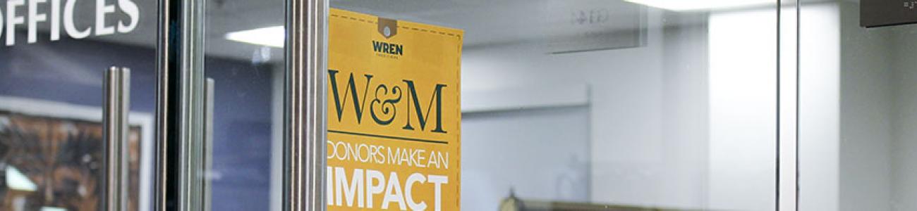 Yellow sign on the Media Center highlighting the importance of donor funding