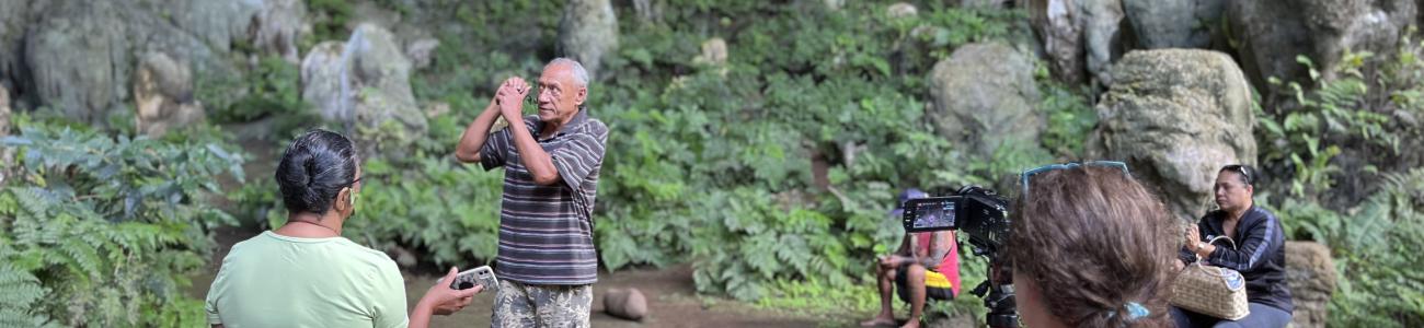 Image of an anthropologist filming an interview during field research