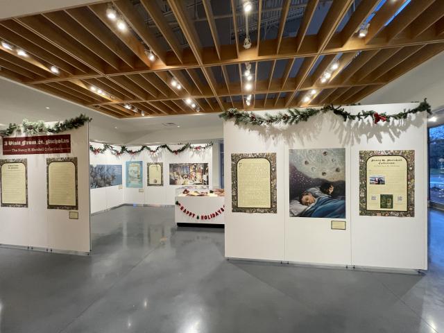 Exhibit panels with illustrations and text related to holiday food culture in 'Twas the Night Before Christmas