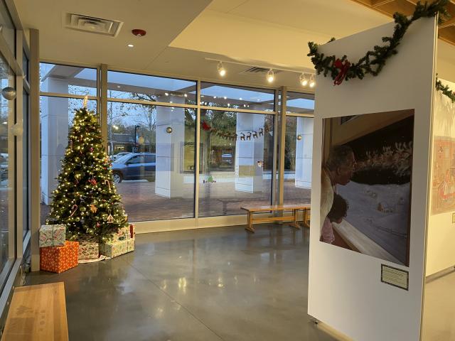 Christmas tree decorated with food ornaments and exhibit panel with illustrations and text related to holiday food culture in 'Twas the Night Before Christmas