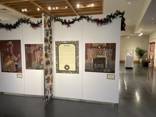 Exhibit panels with illustrations and text related to holiday food culture in 'Twas the Night Before Christmas