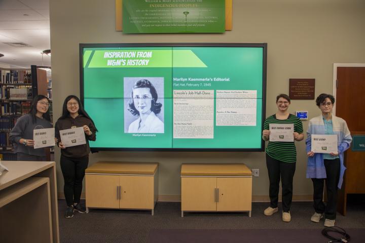 winners of the comics contest stand in front of a photo of the student activist who inspired the contest