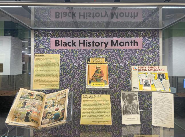 Black History Month exhibit featuring educational games, comics, and ephemera