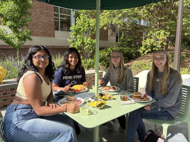Graduating student employees enjoy food and treats at the Student Employee Party on the Patio.