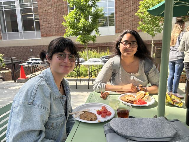 Students enjoying food and treats at the Student employee party at Swem Library
