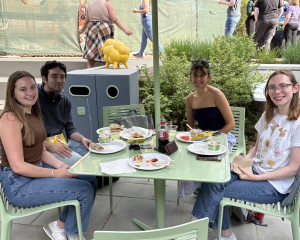 Students enjoying food and treats at the Student employee party at Swem Library