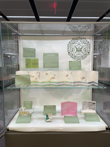 Installed exhibit case with environmental zines