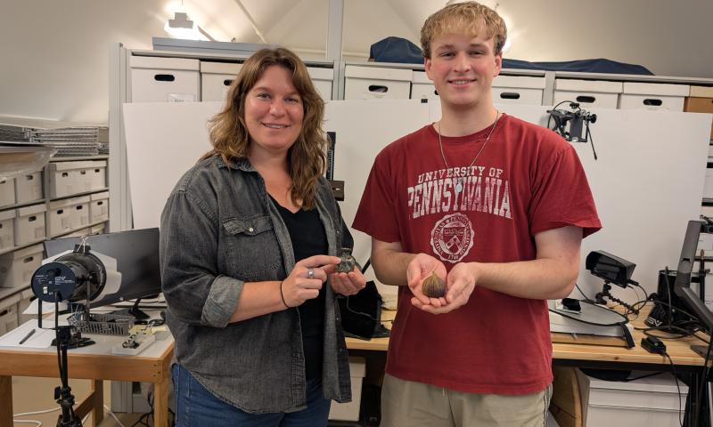 Andrew Francois and curator at Jamestown Rediscovery holding 3D models of artifacts.