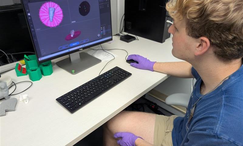 Andrew Francois 3D scanning an artifact