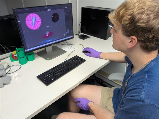 Andrew Francois 3D scanning an artifact