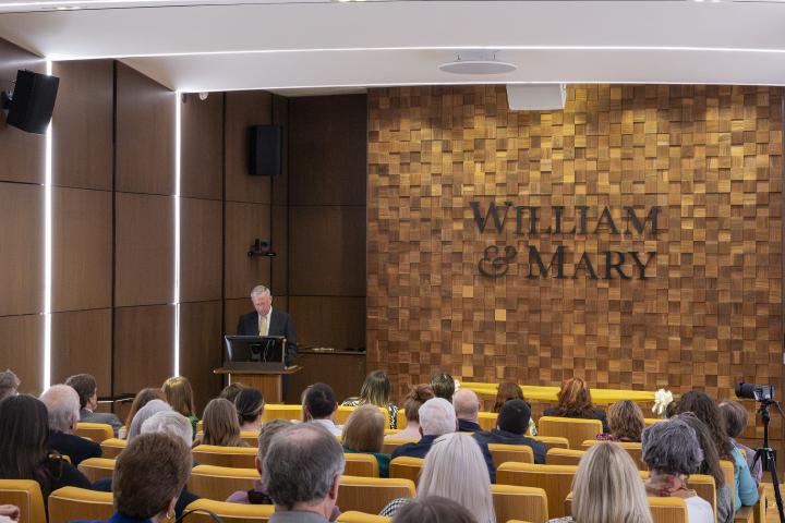 Earle MacKenzie speaking to the crowd in the theatre