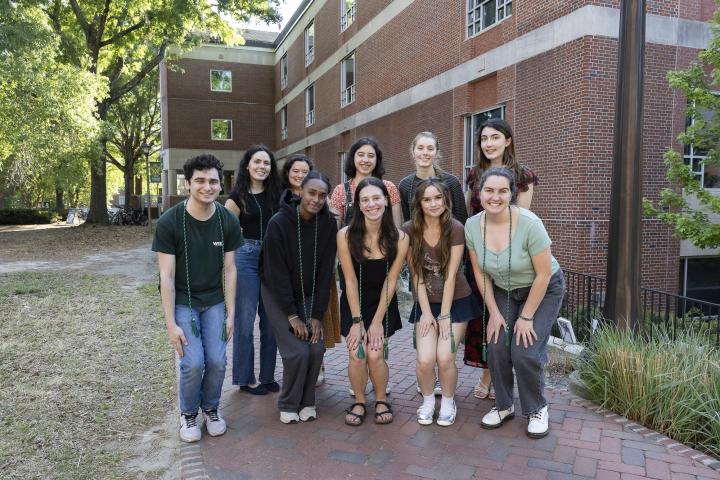 graduating student employees with their chords