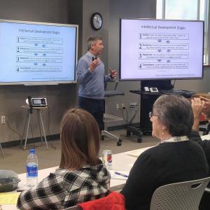 Instructor leading a presentation in the Ford Classroom