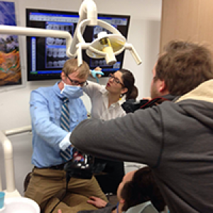 Alumni film a scene in a dentist's office for the 24 Speed Film Festival