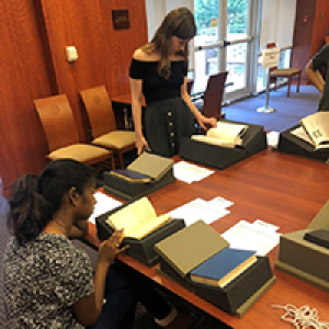 Student examines a book on display in Special Collections