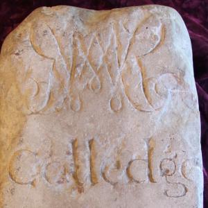 William and Mary boundary stone with cypher and the word "Colledge"