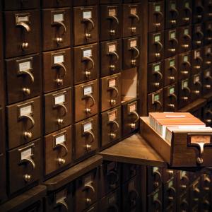 Card catalog with one drawer open