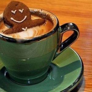 Gingerbread cookie in a mug of coffee