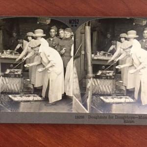 People making and handing out donuts