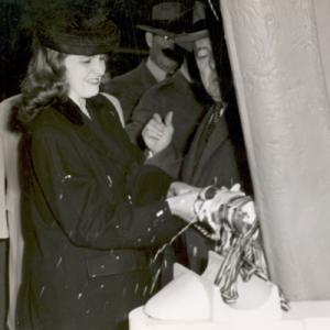 Eleanor Harvey breaks open a bottle