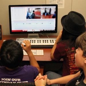 Three students work on a video together in the Reeder Media Center