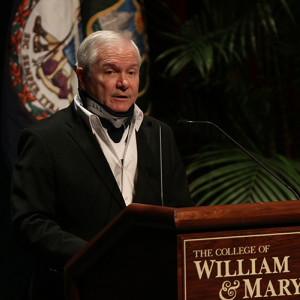 Robert Gates at a podium delivering a lecture