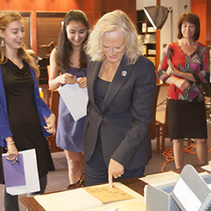 Glenn Close examines a manuscript in Special Collections
