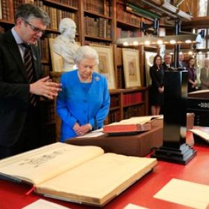 Queen Elizabeth II looks at Georgian papers from the Royal Archives