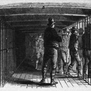 Prisoners exiting a barred cell