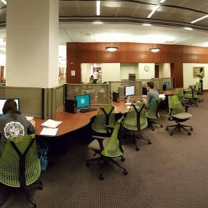 Row of chairs and desks line the info commons in Swem