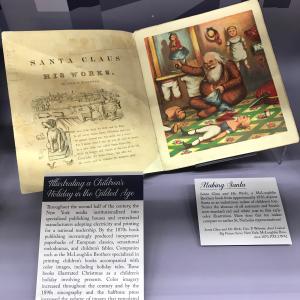 Gilded age book showing illustration of Santa and the words "Santa Claus and his works"