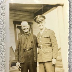 Two people, the younger in military uniform