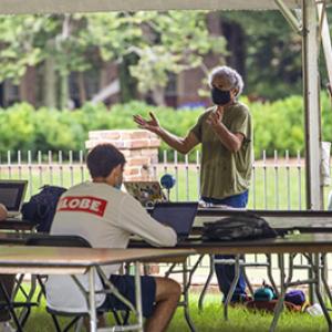 Teacher leading a class outdoors during the pandemic