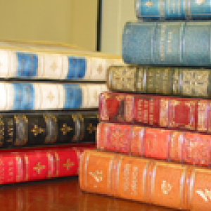 Stack of rare books with colorful covers