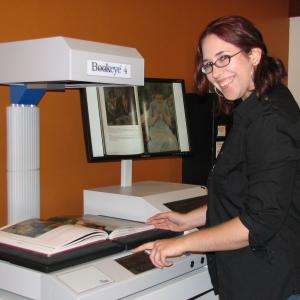 Person scanning a book on the new Bookeye scanner