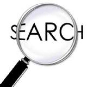 Magnifying glass hovering over the word Search