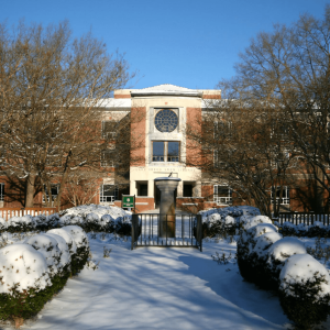 Front entrance of Swem Library with the sun dial in the foreground