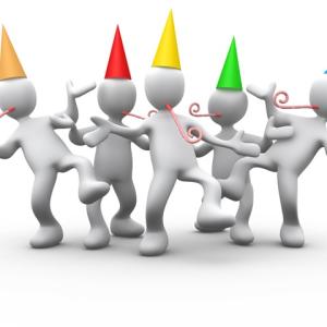 White 3D stick figures wearing party hats