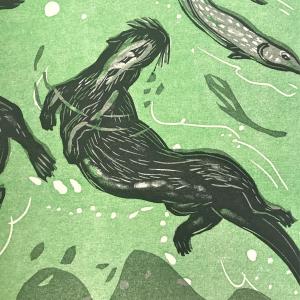 Woodcut print of otter and fish
