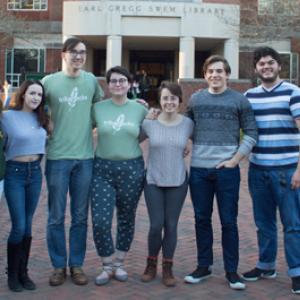 Participants in the hackathon stand outside the entrance of Swem