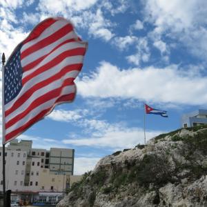 View of American flag flying with the Cuban flag in the distance