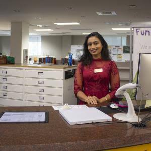 Jarin Eva at the circulation desk